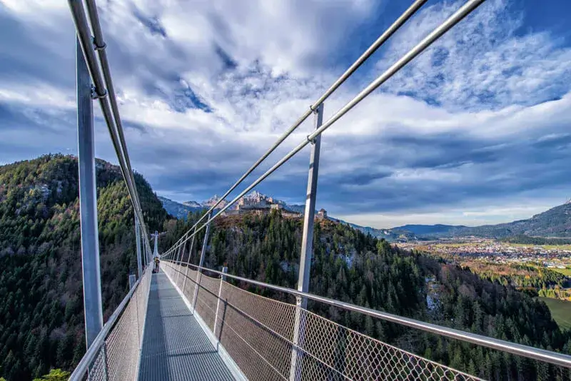 Highline 179, a tibet style footbridge made of steel across a valley at Ehrenberg castle